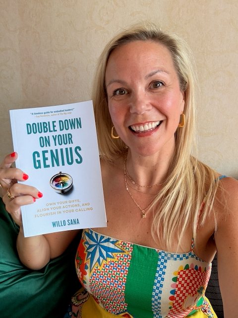 Willo holding her book, Double Down on Your Genius